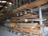 a large amount of wood on the shelves in the warehouse