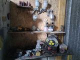 a shelf with a lot of items on it in a room