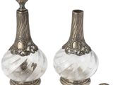 pair of antique silver and glass perfume bottles on stand