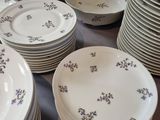 a lot of plates that are sitting on a table