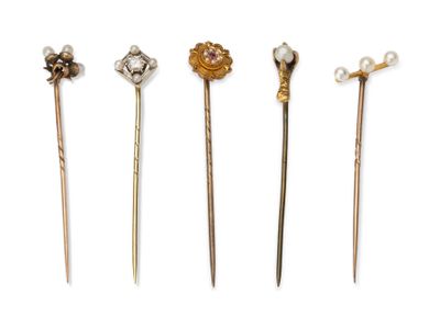 four different types of hair pins with pearls on them