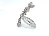 sterling silver ring with a dragonfly design and a diamond center