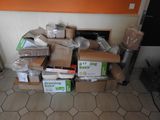 a pile of boxes sitting on the floor in a room
