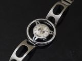 an image of a wrist watch on a black surface