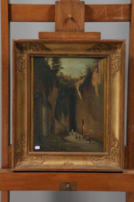 painting on easel in front of a painting of a man and a dog