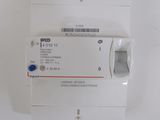 a white electrical device with a blue button on it