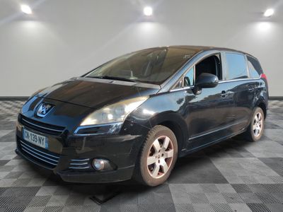 a picture of a black car parked in a garage