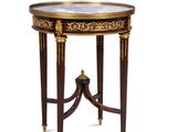 une image d'une petite table avec un plateau en marbre