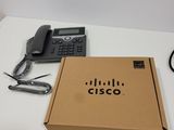 a box that has a phone and a cord in it
