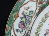 a close up of a plate with flowers on it