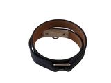 a close up of a black leather bracelet on a white background