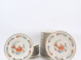 several plates are stacked on top of each other on a white surface
