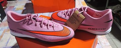 pink and orange nike shoes on display in a shoe store