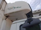 a white truck with a camera attached to it ' s side