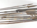 several different types of weapons are displayed on a white surface