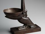 an image of a bronze bowl with a bird on it