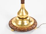 a lamp that is on top of a wooden stand