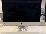 a computer monitor sitting on top of a white desk