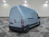 a white van that is parked on a checkered floor