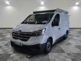 the white van is parked on a checkered floor in a room