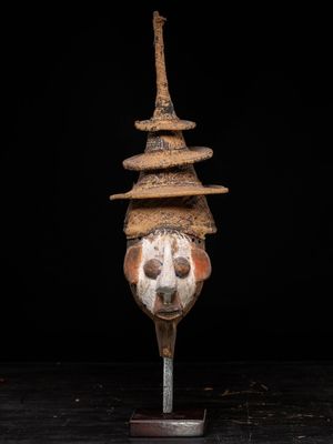 a close up of a sculpture of a skull on a stand