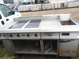 an image of a commercial kitchen with two burners and a sink