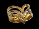 a close up of a gold ring with two hearts on it