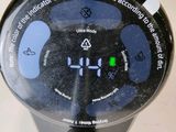 a close up of a digital clock on a pole