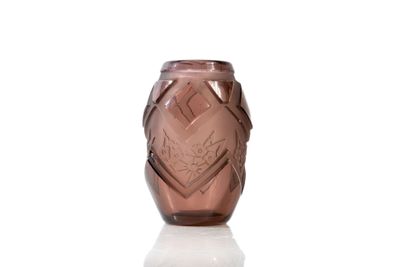 purple glass vase sitting on a white surface with a white background
