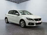 the white car is parked in a white room with a black floor