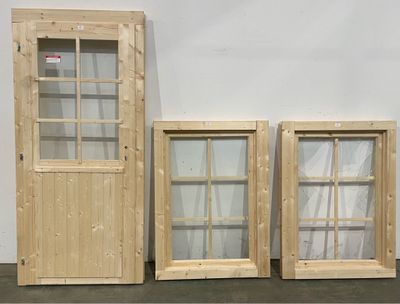 three wooden doors and a window in a room