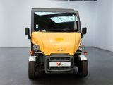 a small yellow car that is parked in a room