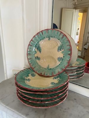 many plates stacked on top of each other on a counter