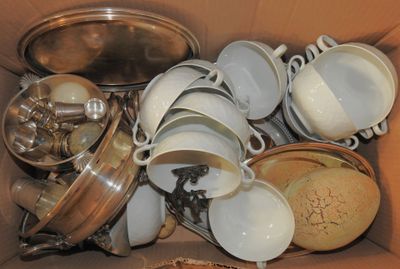 a box full of dishes and pans in it