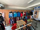 a lot of clothes on display in a store