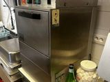 a kitchen with a sink, dishwasher, and other items on the counter