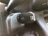 a close up of a car ' s dashboard with a remote control