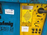a blue machine with a yellow door and some stickers on it