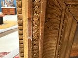 a picture of a gold framed mirror in a room