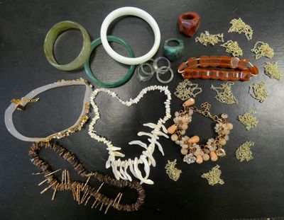 many different types of jewelry on the table