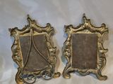 pair of antique brass picture frames on a white background
