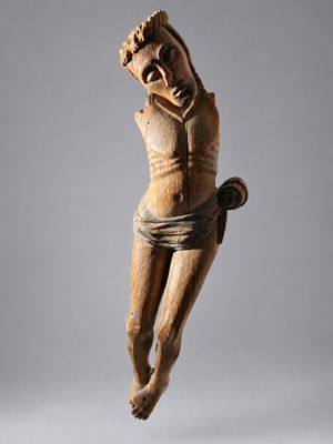 an image of a wooden statue of a man on a horse