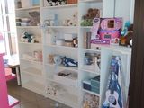 a room with a lot of shelves and shelves on the wall