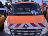 an orange van that is parked in a parking lot