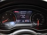 a close up of a car dashboard with various gauges