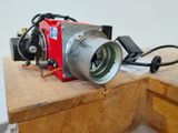 a red camera sitting on top of a wooden table