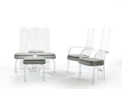 three clear chairs and a stool are sitting in a white room