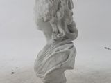 a white marble bust of a woman with a long hair