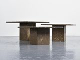 two tables that are sitting in the middle of the floor