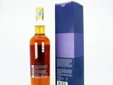 an image of a bottle of whisky next to a blue box